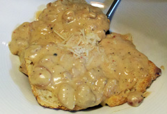 Nage_brunch_sausage_gravy_over_biscuits